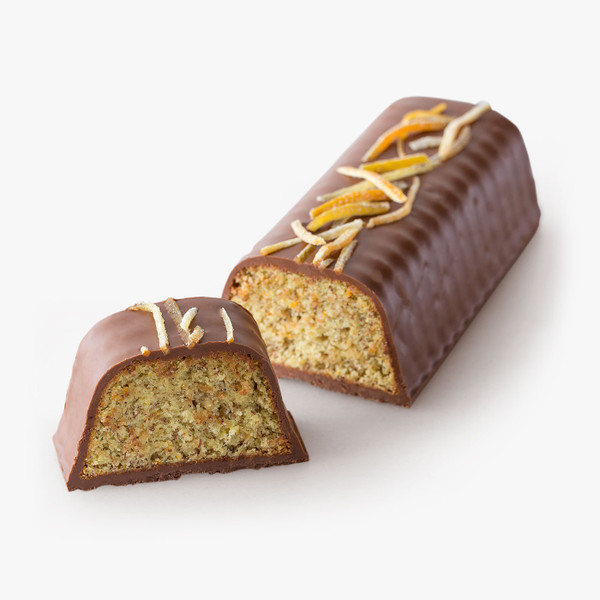 Hazelnut Orange Cake. A moist flourless cake made with ground hazelnuts and fresh oranges is enrobed in a generous layer of hazelnut gianduja and sprinkled with candied orange peels.